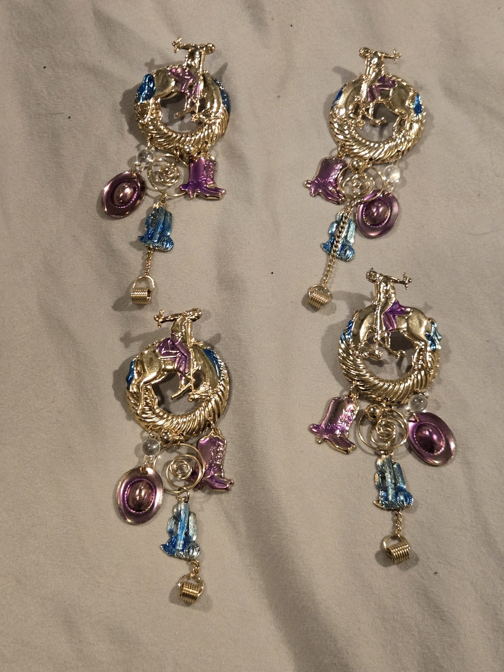 Gold-tone Cowboy Charm Dangle Earrings with Pink, Purple, and Teal Accents